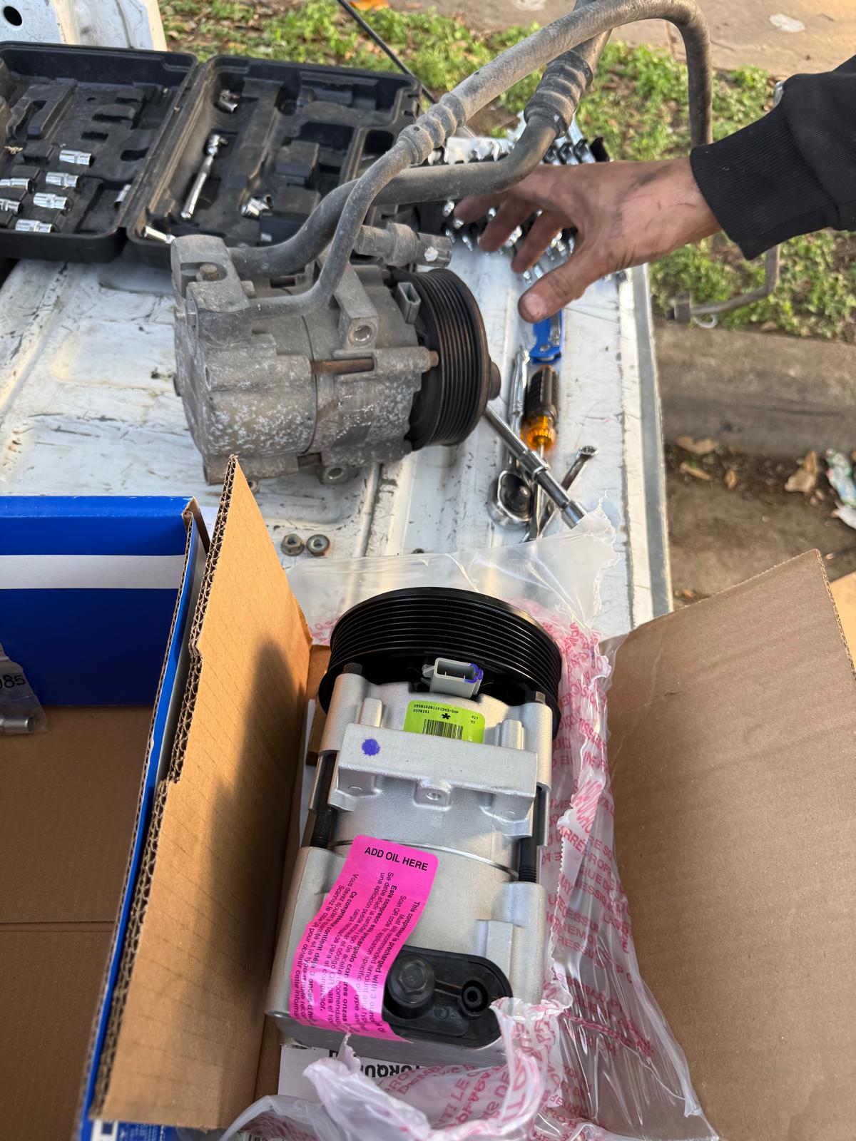 A/C compressor and belt service on commercial truck