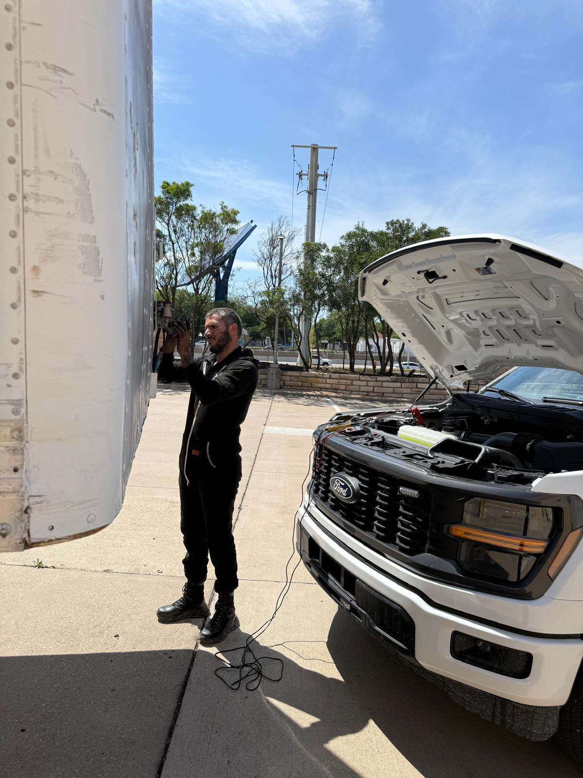 Truck mechanic inspecting commercial vehicle Austin TX