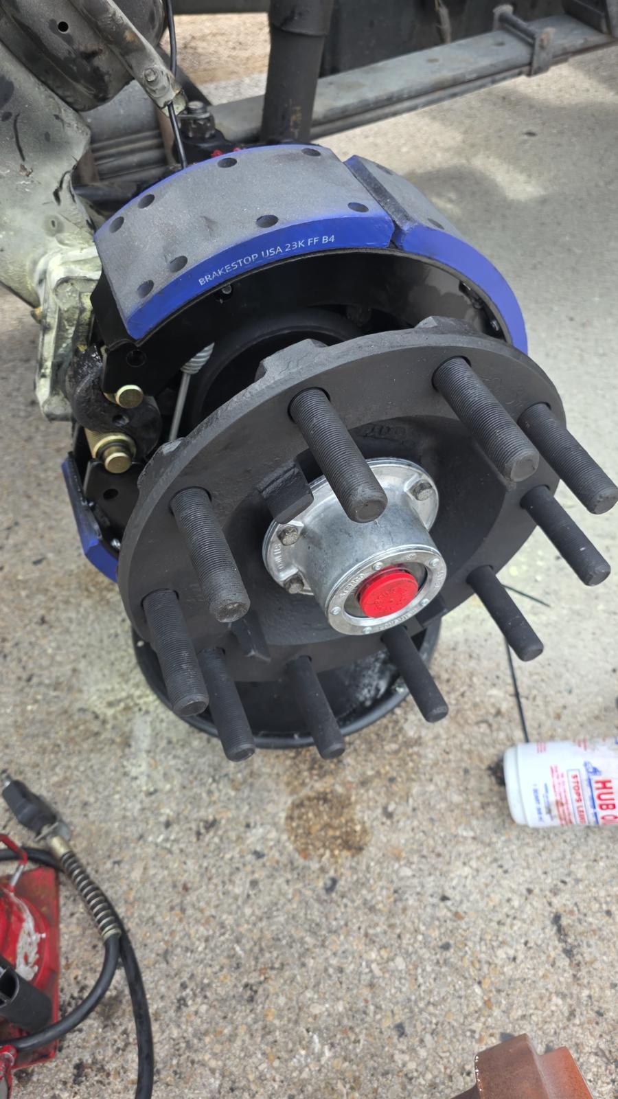 Changing semi truck tire on highway roadside service